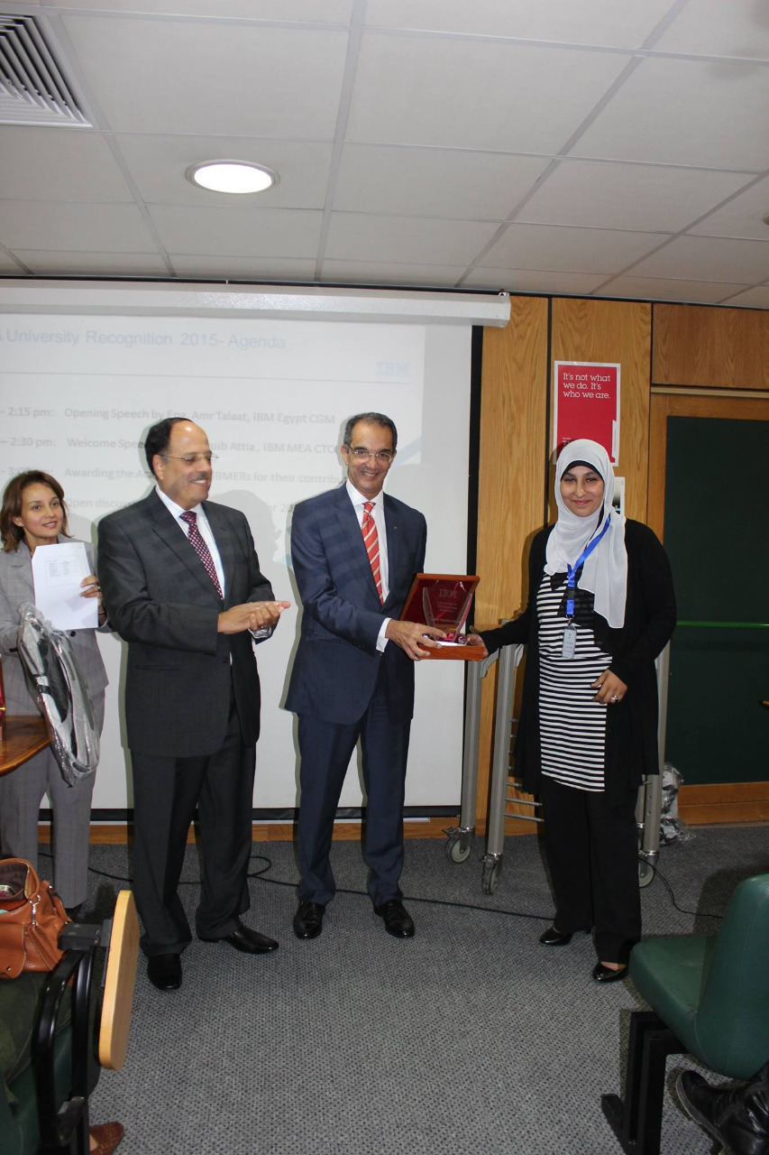 Dr. Moshira Ghaleb receiving an award